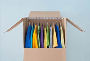 Clothing hanging in a wardrobe box, ready to be moved